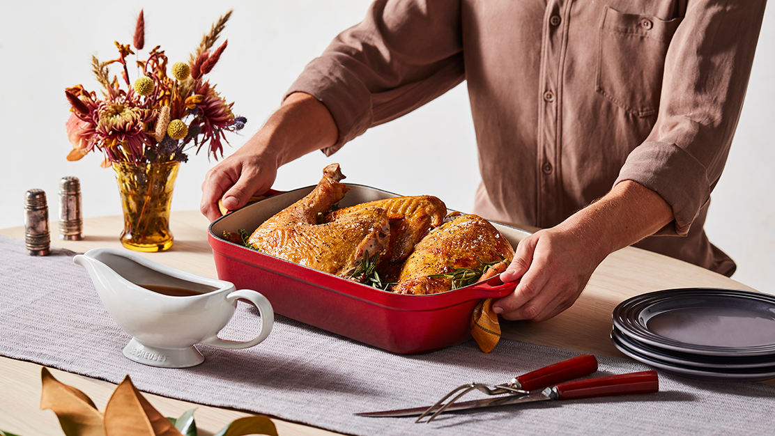 Host setting dinner table