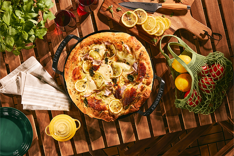 Pizza with cheese, lemon & fresh herbs